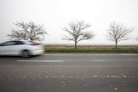 Motion blurred truck going fast on a rural roadの写真素材