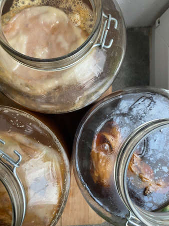 Raw fermented homemade alcoholic or non alcogolic kombucha superfood. Ice tea with healthy natural probiotic in large glass jars, fermentingの写真素材