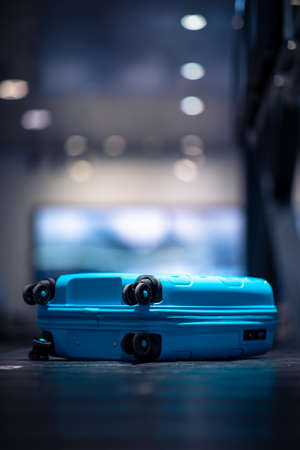 People at an international airport, at the baggage claim zone - motion blurred imageの写真素材
