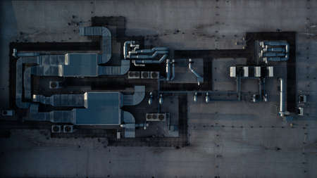 Air conditioning equipment atop a modern building - aerial/drone view of the roof with all the...