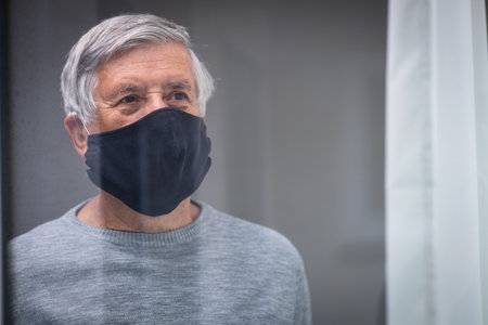 Senior man wearing protective face maskの写真素材