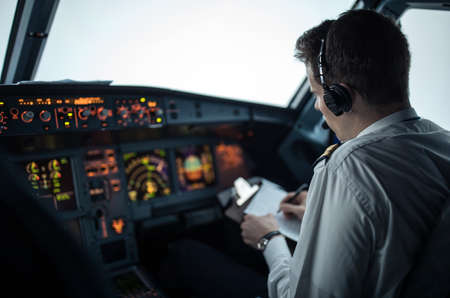 Commercial airliner airplane flight cockpit during takeoffの写真素材