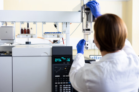 Chemist is analyzing sample in laboratoryの写真素材
