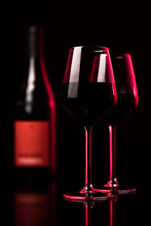Bottles of quality red wines shot with shallow DOF; color toned imageの写真素材