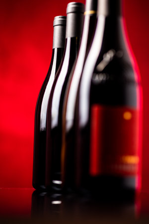Bottles of quality red wines shot with shallow DOF; color toned imageの写真素材