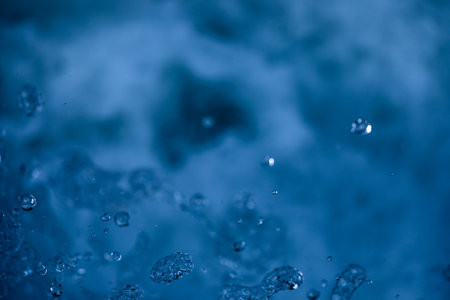 Water concept - river water flowing with light reflecting of its surface - long exposure shotの写真素材
