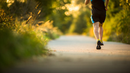 Shot of a young male athlete training. Getting his daily dose of mileage, to stay fit and lean.の写真素材
