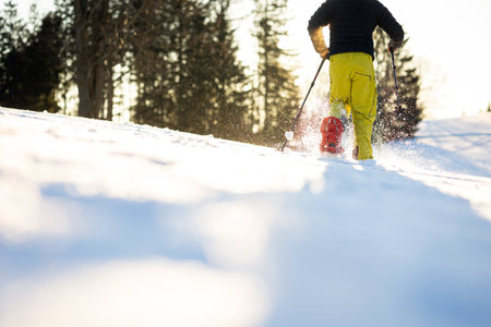Snowshoeing in winter in deep snow. Walking in the snow. Hiking in the mountains in winter.の写真素材