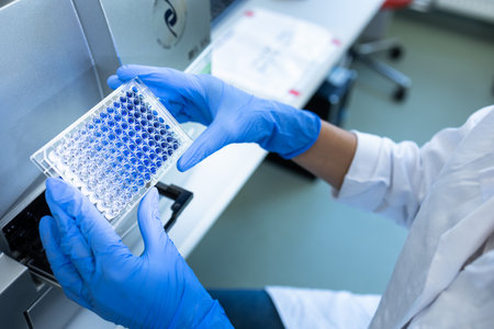 Female researcher carrying out research experiment in a chemistry labの写真素材