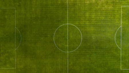 Aerial view of green football, soccer pitch. Top down view on a green, empty soccer fieldの写真素材