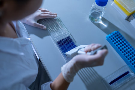 Female researcher carrying out research experiment in a chemistry labの写真素材