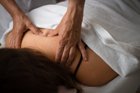 Massage procedure - neck and whole body massage by a female masseuse. doing massaging using oil....