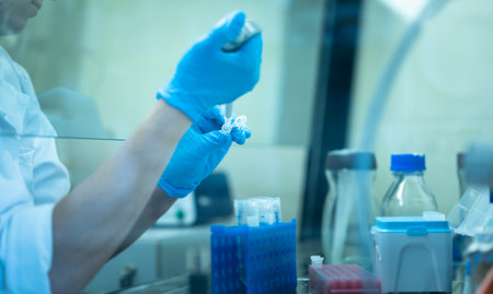 Female researcher carrying out research experiment in a chemistry labの写真素材