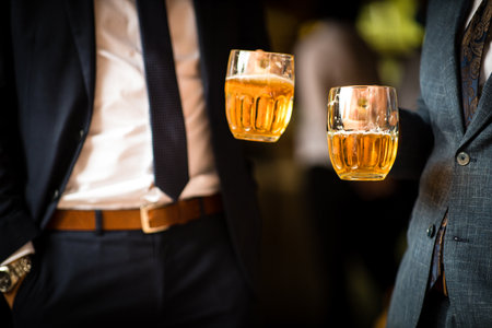 People drinking beer together at a company party, well dressed.の写真素材