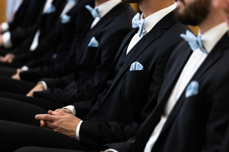 Guests sit on benches during a wedding in the Catholic Church.の写真素材