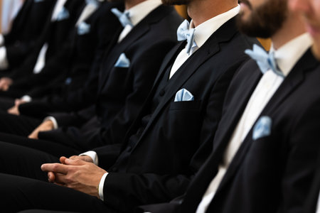 Guests sit on benches during a wedding in the Catholic Church.の写真素材
