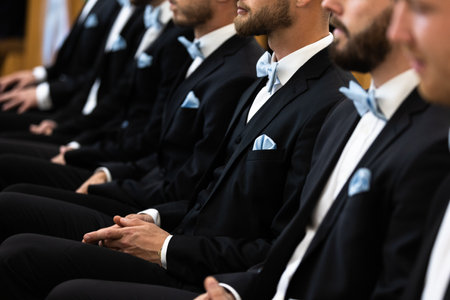 Guests sit on benches during a wedding in the Catholic Church.の写真素材