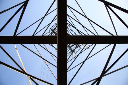 View at a high-voltage electricity pylon from directly below, which deconstructs the subject from its function and treats it as a mere sofisticated geometric abstract.の写真素材