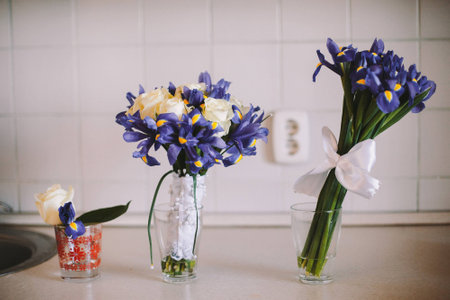 Three wedding bouquets stand on the table in the morningの写真素材