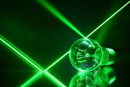 Laser beams and a lamp lying on the with mirrorの写真素材