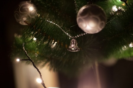 Lights and Christmas toys on the christmas tree with Blurred abstract dark background!の写真素材