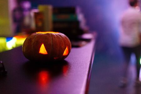 Halloween pumpkin face lantern at night with misty smoke. Halloween background..の写真素材