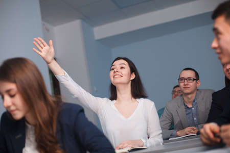 2016.01.17 Business school training in the Samara State University. Lady student is raising her hand in class for an answer.のeditorial素材