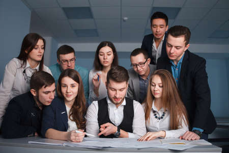 2016.01.17 Business school training in the Samara State University. Multinational team works. Busy start up partners working in casual clothes, so focused, discussing the ideas for new strategy.のeditorial素材