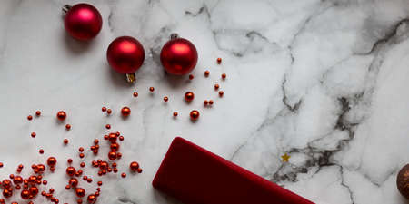Decorated Christmas wreath with cones and beads, on a stone backgroundの写真素材