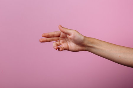 Instruction: how to hold chopsticks eat with chopsticks. Isolated on pink background. step 2の写真素材