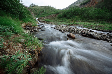 The waterfalls of the mountain river on a cloudy day. Plateau putoranaの写真素材