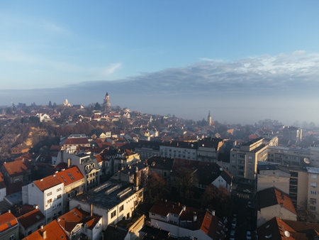 Drone aerial view of Belgrade city in the smog and fog in the morning. Zemun and New Belgrade district, Serbia, Europeの写真素材