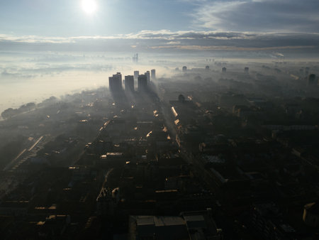 Drone aerial view of Belgrade city in the smog and fog in the morning. Zemun and New Belgrade district, Serbia, Europeの写真素材