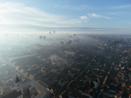 Drone aerial view of Belgrade city in the smog and fog in the morning. Zemun and New Belgrade district, Serbia, Europeの写真素材