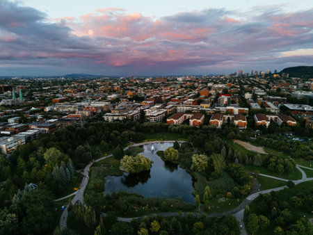 Drone view of the colorful sunset and park, downtown, and Royal Mountain in the background. Montreal, Canadaの写真素材