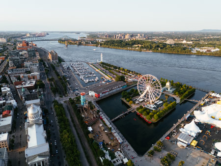 Drone view of Old Port City waterfront park with an entertainment venue and Jacques Cartier Bridge in the background. Montreal, Canadaの写真素材