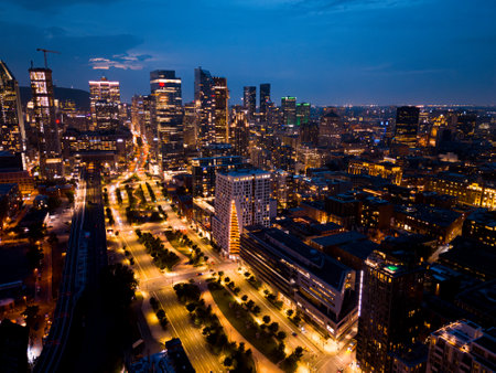 Montreal skyline illuminated at dusk and reflected in the water, Quebec, Canada.の写真素材