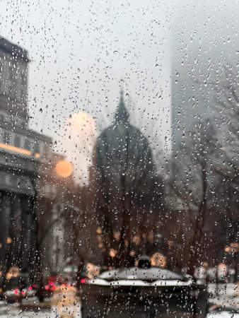 The raindrops on the window with downtown skyscrapers in the background. Montreal, Quebec, Canadaの写真素材