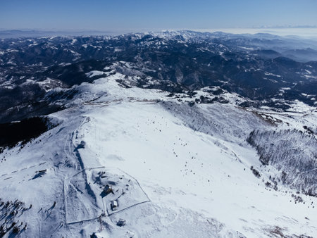 Panoramic view of the ski slope with the mountains and wood. Kopaonic ski resort in Serbia