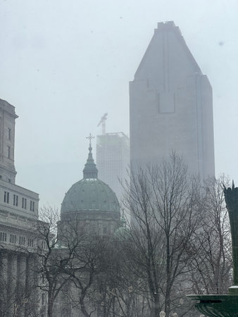 Aerial winter view of Cathedral Marie-reine-du-Monde and skyscraper in Downtown Montreal Cityの写真素材