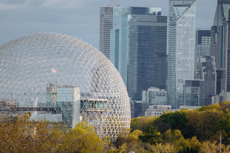 Drone view of Montreal Biosphere at the Park Jean-Drapeau, with the downtown of Montreal in the...
