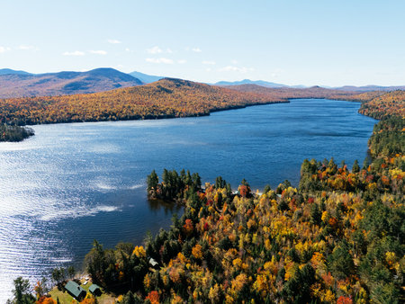 Fall Colours in the White Face Mountain ski resort and lake. Color Change, Vermont, USA.の写真素材