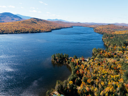 Fall Colours in the White Face Mountain ski resort and lake. Color Change, Vermont, USA.の写真素材