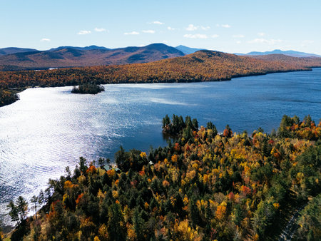 Fall Colours in the White Face Mountain ski resort and lake. Color Change, Vermont, USA.の写真素材