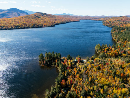 Fall Colours in the White Face Mountain ski resort and lake. Color Change, Vermont, USA.の写真素材