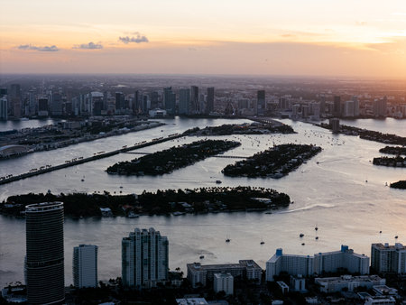 Aerial view of Biscayne Bay and Miami skyline at sunset with small islands and boats in the water. g.の写真素材