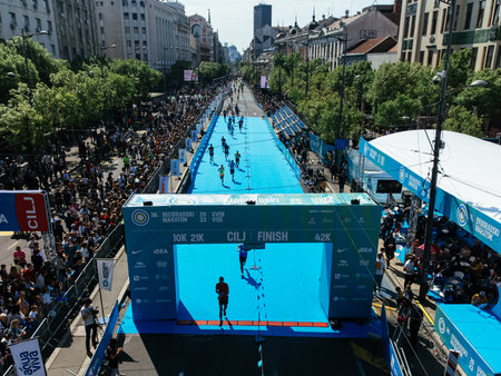 23rd of April 2023, Belgrade, Serbia. Thousands of runners at 10K race start during Belgrade Marathon, aerial view of urban event. g.の写真素材