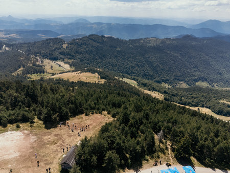Aerial view of Zlatibor highlands village with forested hills and scattered houses in summer. g.の写真素材