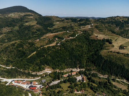 Aerial view of Zlatibor highlands village with forested hills and scattered houses in summer. g.の写真素材