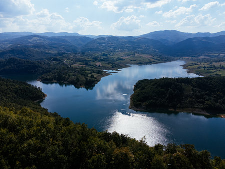 Aerial view of Rovni Lake reservoir and surrounding hilly landscape in Serbia. g.の写真素材